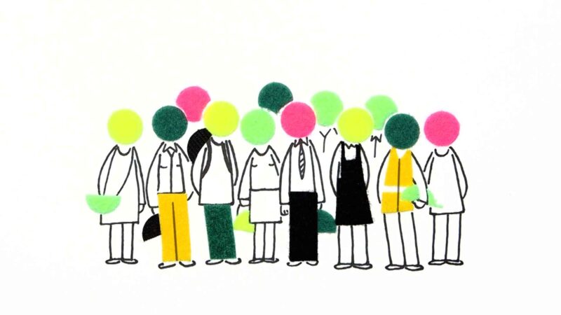 A collection of 12 coloured VELCRO® brand dots arranged to form the heads of a people. The people are dressed in a range of outfits—high vis jacket, suit and pants, black dress—indicating they are from a range of professions.