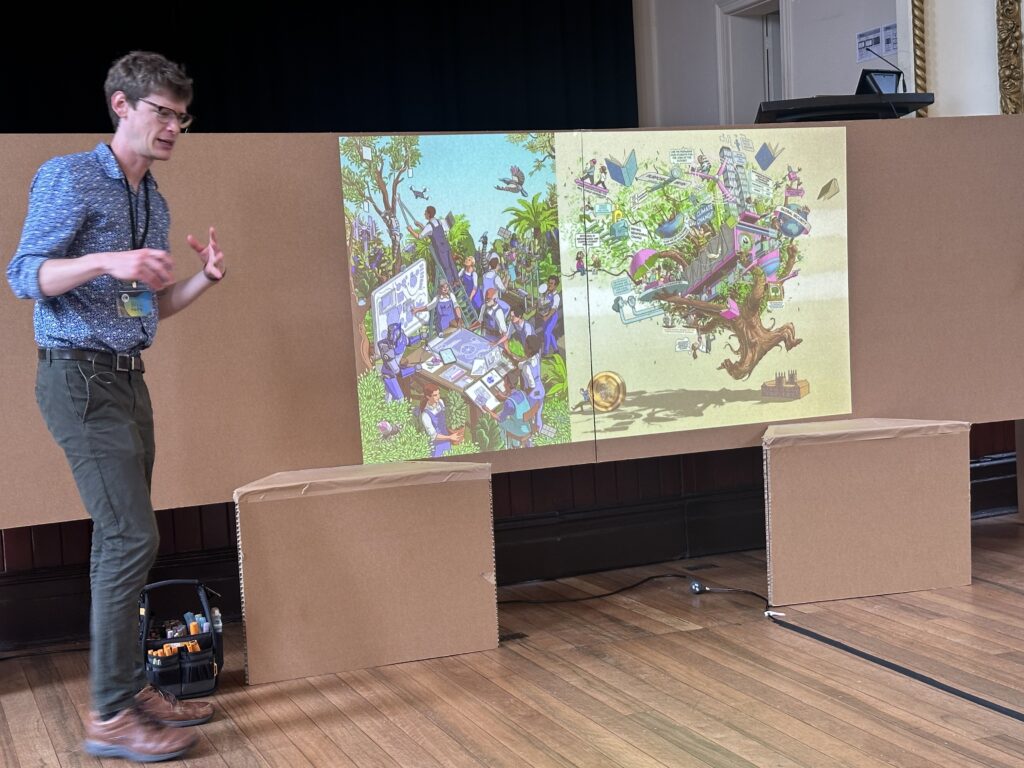 Bill Hope presenting his opening keynote "Expanded graphic recording", with a slide showing one of the many detailed illustrations he has done for children's books